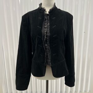 Black velvet jacket with ruffled details and button-up front. Size: L